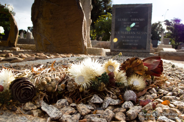 Grave stone and flowers