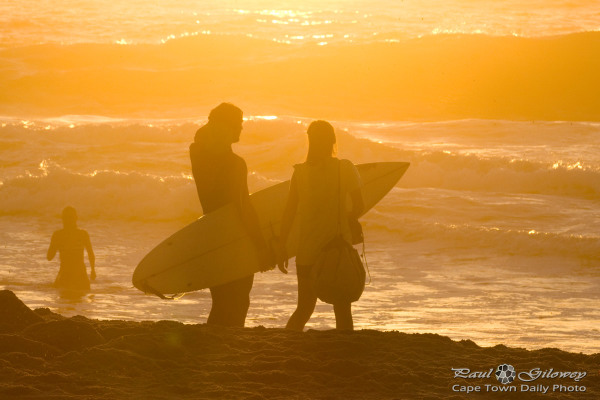 Golden surfer silhouette